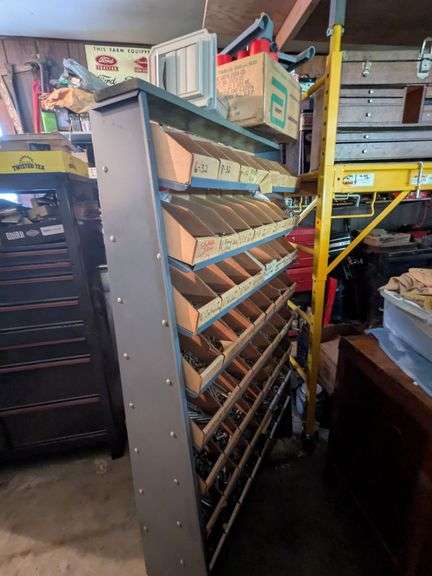 Metal rack w/ nuts and bolts, misc contents on top image