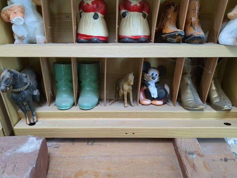 Winston curio cabinet with California Raisens, Mickey, and other misc figurines, cowboy boot salt/pepper shakers