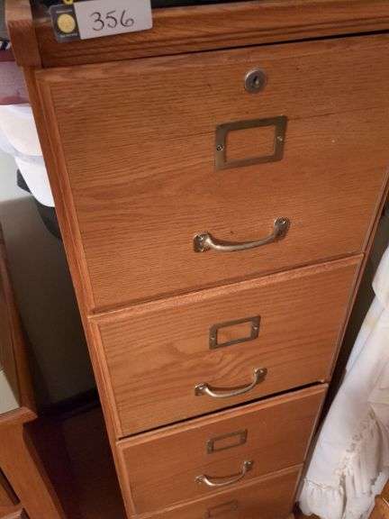 Filing cabinet, JVC 20" TV, Toshiba VHS player, VHS rewinder and International hats with stand