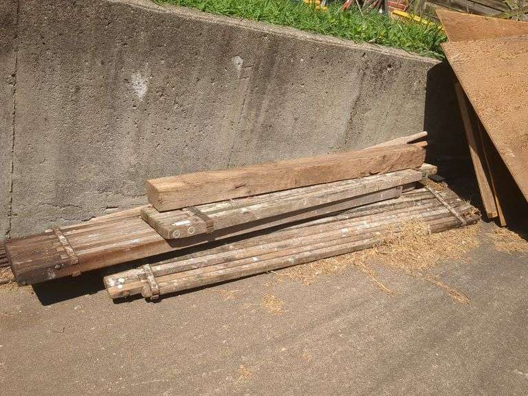 Metal pipes, plumbing pipes, scaffolding and sheets of wood
