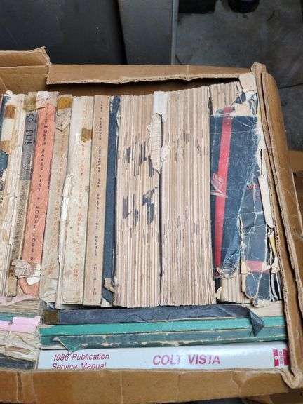 Lot of boxes car manuals image