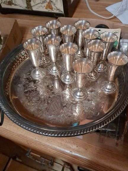 12 Sterling silverKiddish cups and Silver plated tray, oil bottle, candle holders and misc.