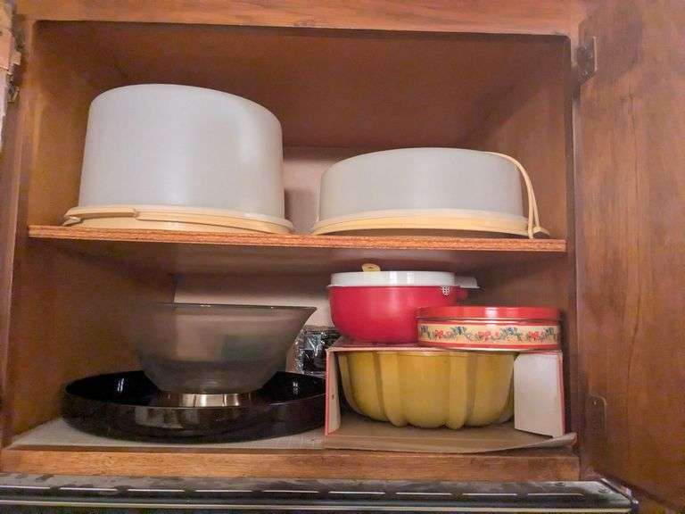 Top 2 shelves: cake carriers, punch bowl, bundt pan and misc. image