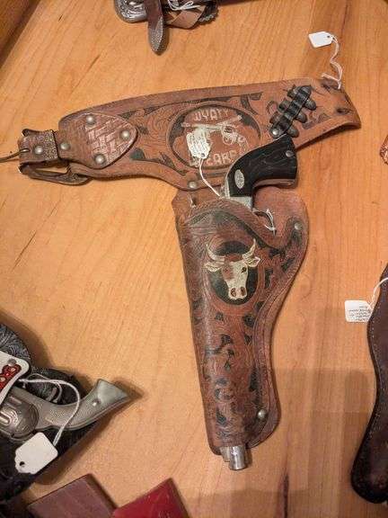 Leslie-Henry revolving cylindar cap pistol w/ Wyatte Earp holster image