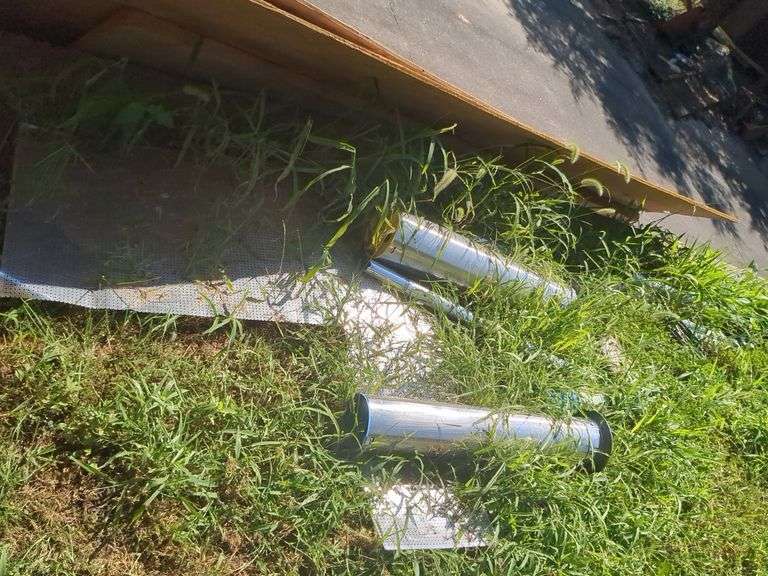 Metal pipes, plumbing pipes, scaffolding and sheets of wood