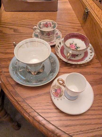 4 China teacups and saucers image