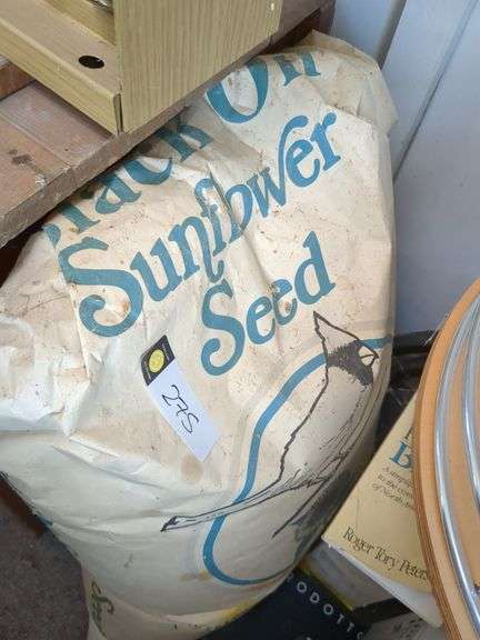 Hummingbird feeder, boxes of thistle seed, bag of sunlfower seed, bird guide