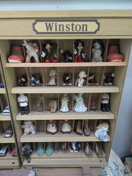 Winston curio cabinet with California Raisens, Mickey, and other misc figurines, cowboy boot salt/pepper shakers image