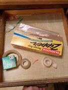 Top 3 drawers: silverware, kitchen gadgets, tape and misc.