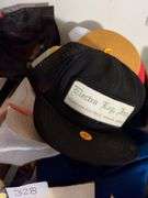 Box of hats including hats from overseas and hat stand