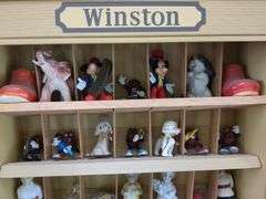 Winston curio cabinet with California Raisens, Mickey, and other misc figurines, cowboy boot salt/pepper shakers