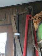 3 hand saws and 3 pieces of wall art