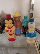 Set of 4 1960s Soaky Bubble Bath bottles: Donald Duck, Mighty Mouse, Smokey the Bear, and Jiminy Cricket