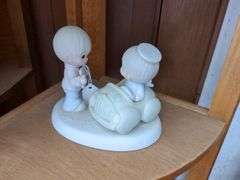 3 Precious Moments figurines and shelf (28" x 15" x 10")