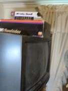 Filing cabinet, JVC 20" TV, Toshiba VHS player, VHS rewinder and International hats with stand