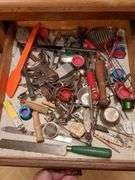 Top 3 drawers: silverware, kitchen gadgets, tape and misc.