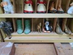 Winston curio cabinet with California Raisens, Mickey, and other misc figurines, cowboy boot salt/pepper shakers