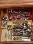 Top 3 drawers: silverware, kitchen gadgets, tape and misc.