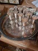 12 Sterling silverKiddish cups and Silver plated tray, oil bottle, candle holders and misc.