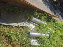 Metal pipes, plumbing pipes, scaffolding and sheets of wood
