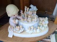 3 Precious Moments figurines and shelf (28" x 15" x 10")