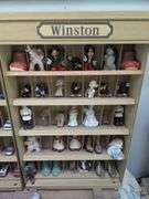 Winston curio cabinet with California Raisens, Mickey, and other misc figurines, cowboy boot salt/pepper shakers