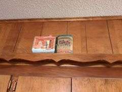 Decorative dishes and tins on top ledge