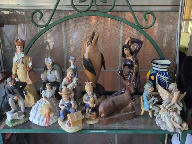 Porcelain and wooden collectible figurines: Avon Rhett Butler & Scarlett O'Hara, Homeco Denim days boy and girl, wooden dolphin and misc. image