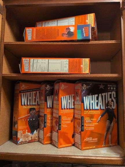 7 2000s Wheaties boxes featuring Tiger Woods, Carly Patterson and Carl Lewis image