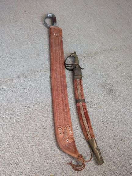 Small sword with scabbard made in India and Larger sword with sheath image