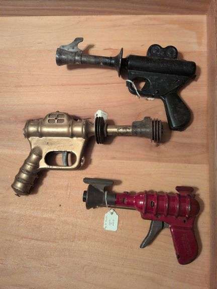 Daisy Buck Rogers XZ-31 Rocket Pop pistol, Daisy Buck Rogers Automic Pistol, and Wyandotte Ray Gun image