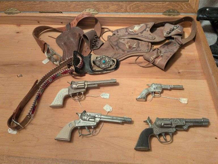 4 Vintage cap pistols w belts and holsters image