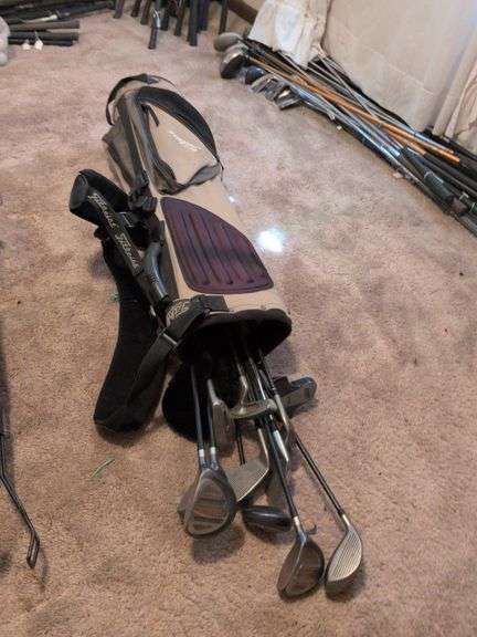 Set of misc. golf clubs in Titleist golf bag image
