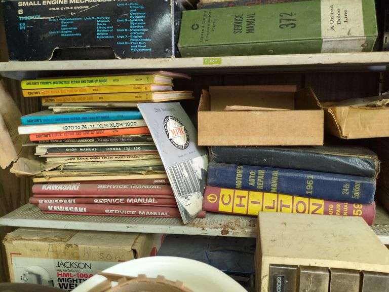 Shelf of Automotive Books and Service Manuals image