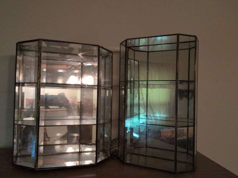 2 mirrored display cases and floor lamp image