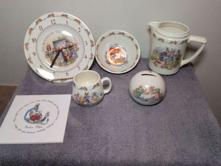 Royal Doulton Bunnykins collection: bowl, jug, coin bank, clock and mug and Beatrice Potter Peter Rabbit tile image