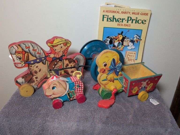 Fisher Price toys: Gong Bell cowboy riding horse, Peter pig #479, Easter walking duck #305 w/ Fisher Price toy guide image
