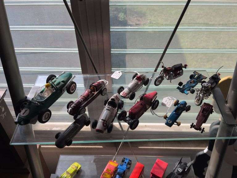 Toy racecars and motorcycles image
