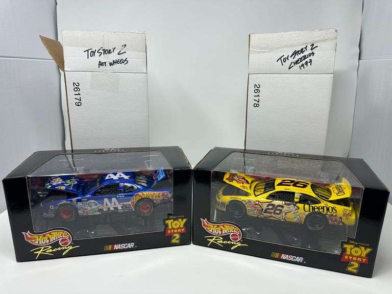 (2) 1999 Hot Wheels Select Racing 1:24 (White outer box, printed retail box with window, hood and deck lid raised, mirrored base) Cheerios #26 “Woody” 26178 and Hot Wheels #44 “Buzz Lightyear” 26179