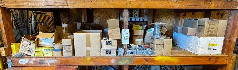 Contents of Shelving Unit Containing Electrical Connectors, Straps, Staples, and Wire image