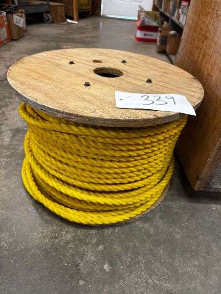Spool of Yellow Synthetic Rope on Wooden Reel image