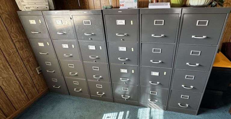 Office Furniture Set Including File Cabinets, Desk, Chairs, and Equipment image