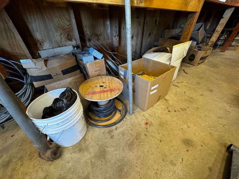 Grouping of Industrial Lights, Wire Spools, and Electrical Supplies image