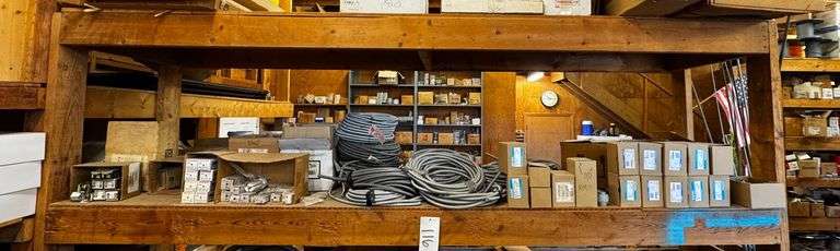 Grouping of Electrical Supplies Including Flexible Conduit, Connectors, Fluorescent Bulbs, and Lighting Fixtures image