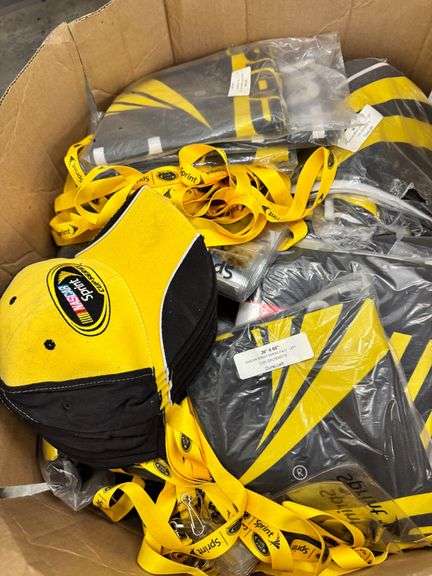 Six Cartons of NASCAR and CAN-AM Branded items - Nextel Plastic Cups, Hats, Lanyards, Flags, CAN-AM Crew Shirts, Sprint Towels image