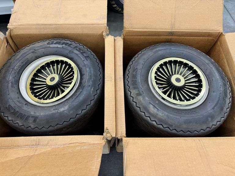 Four Golf Cart Wheels and Tires with Gold Hubcaps image