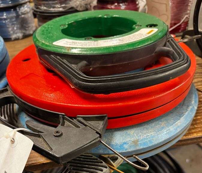 Grouping of Assorted Brand and Length Steel Fish Tapes on Winder Reels, including Greenlee and Ideal. image