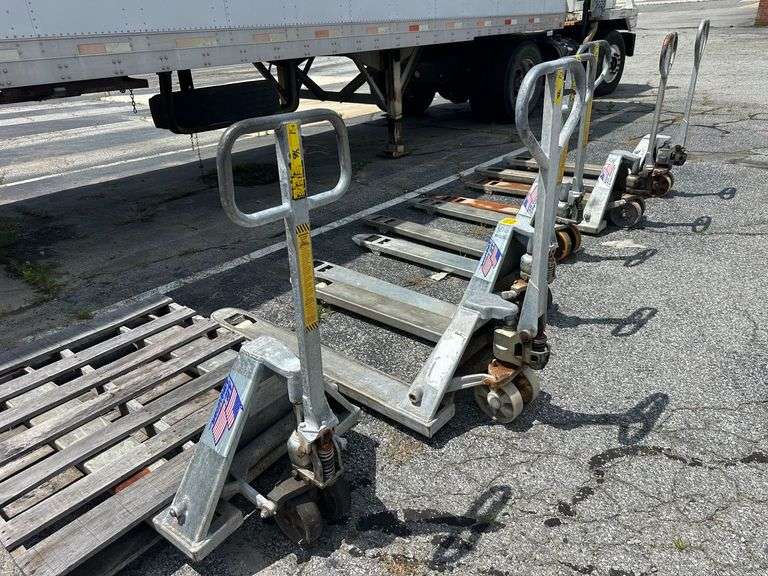 Six Pallet Jacks (some inoperable)