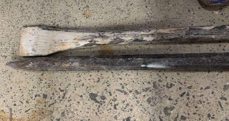 Grouping of Pry Bars and Sledge Hammer