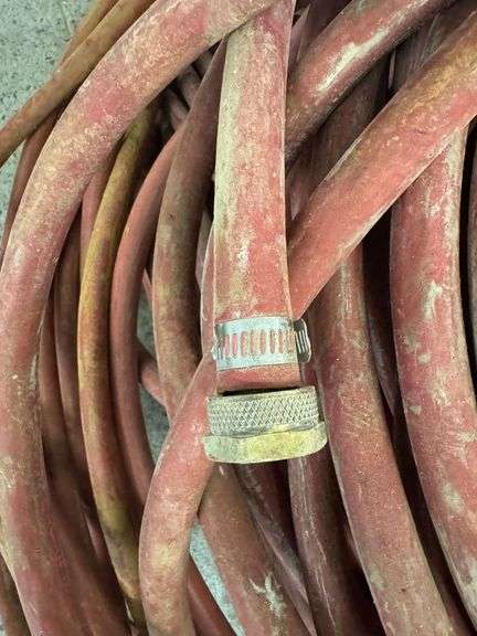 Bundle of Red Industrial Water Hoses